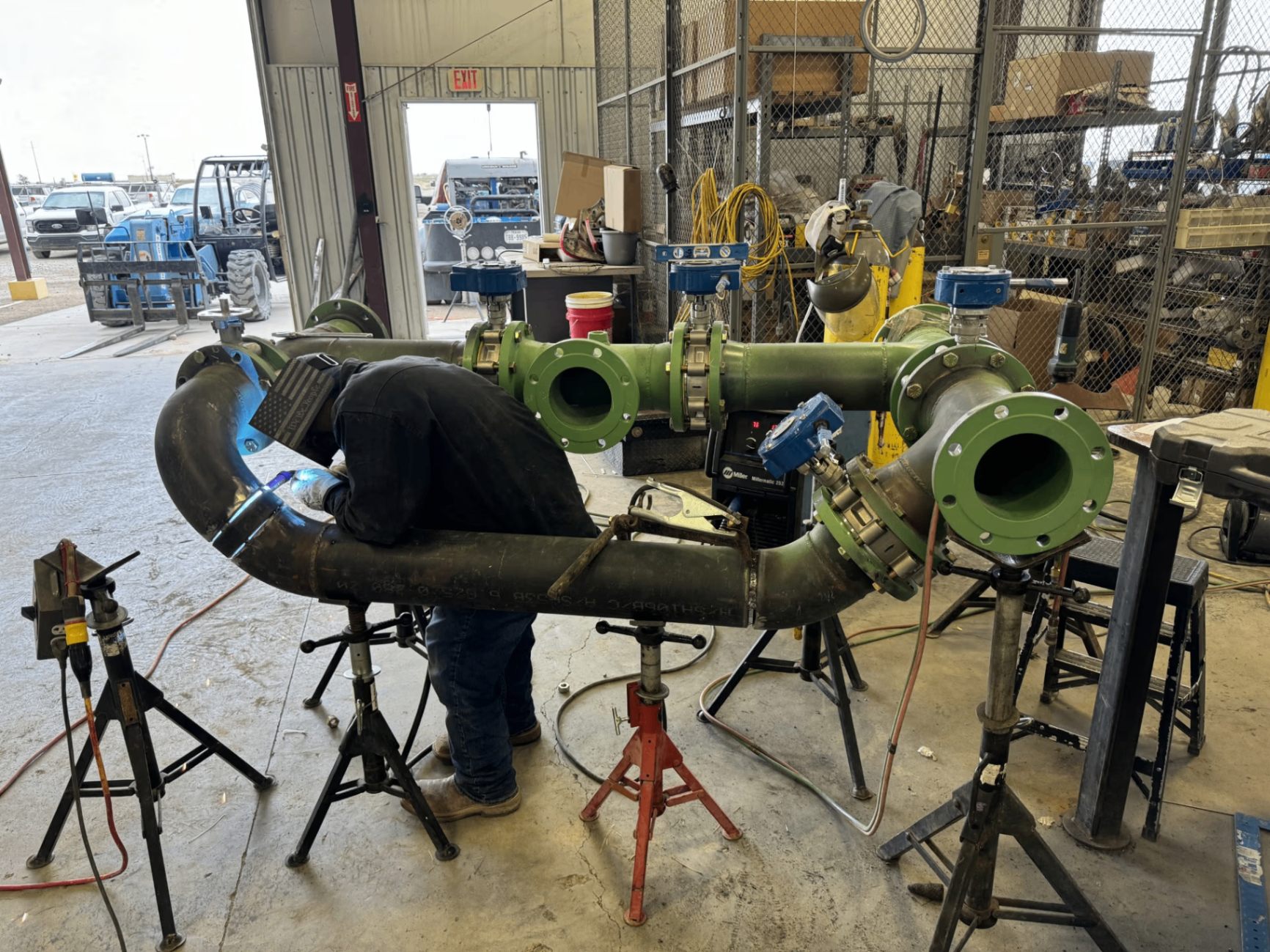 Rebel Welding technician TIG welding a manifold with flanged valves